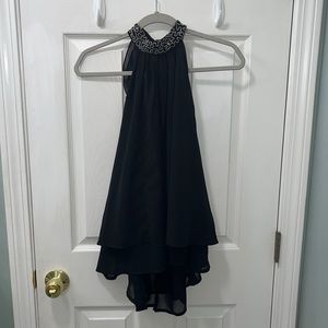 Truth NYC Size small black top with gorgeous beading and a fun ruffled back